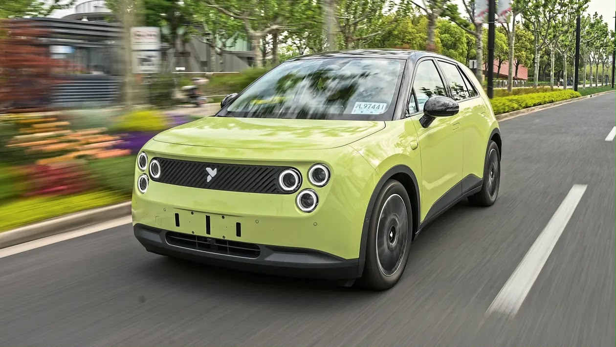 Compact electric vehicle driving on the road